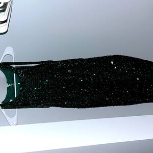 Dark green sparkle dress with shoulder tassels that hang off your arms.